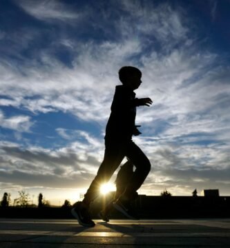 Silhouette running with sunrise background