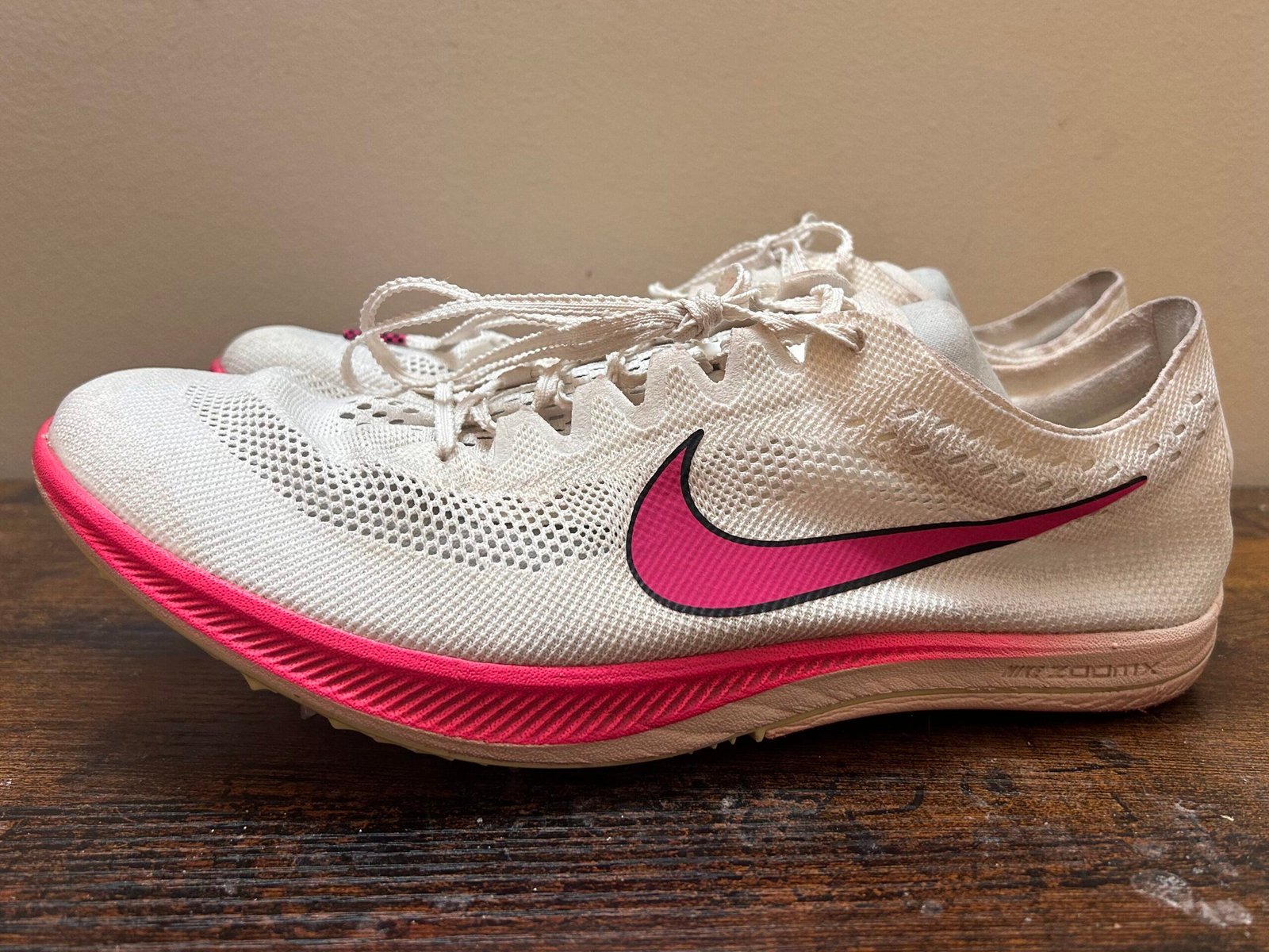 White and Pink Nike Dragonfly racing spike side profile